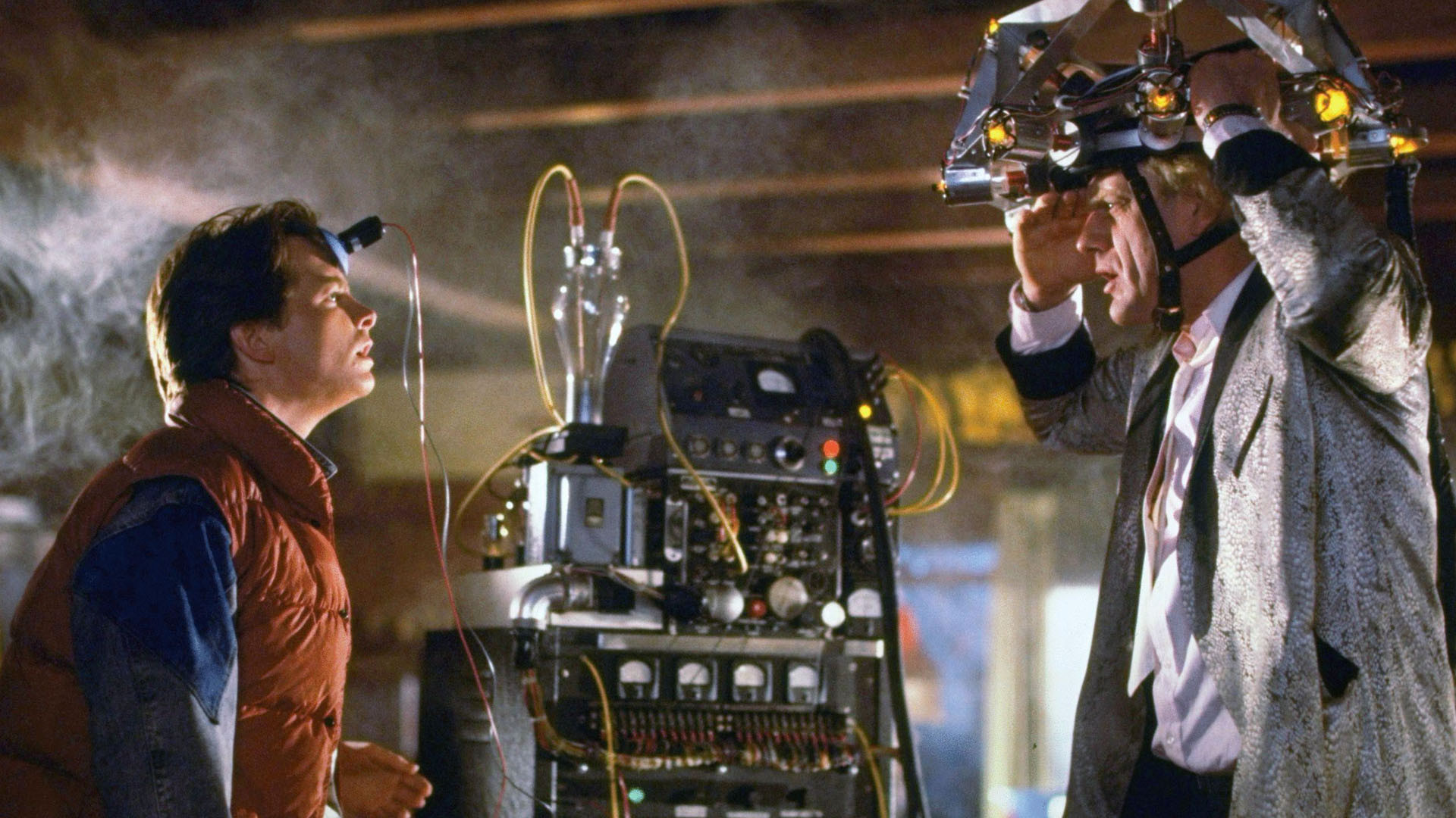 Still from Back to the Future of Marty and the Doc looking at each other while wearing various hi-tech apparatuses