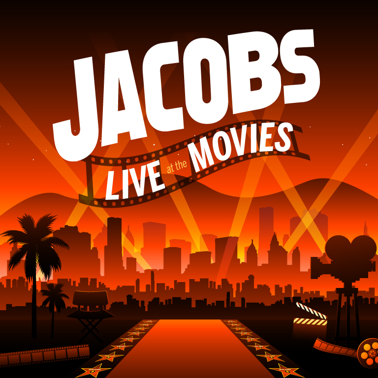 Title Art for Jacobs Live at the Movies. Image shows Title set in Hollywood location with red carpet, palm trees, and a director's chair in the foreground. The background is mountains, a big city skyline, and flood lights.